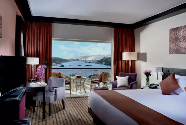 Luxury hotel room at Mövenpick Resort Aswan with balcony and Nile River view in Aswan Egypt