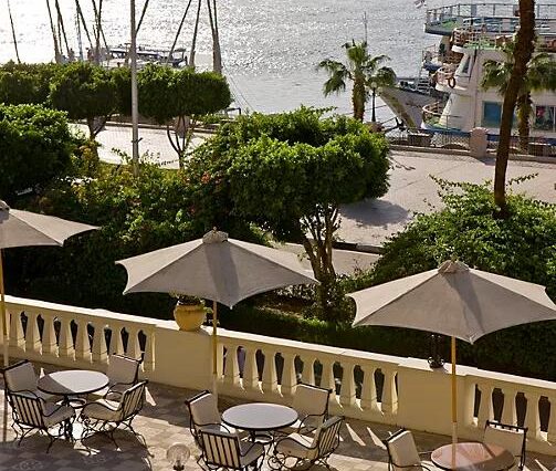 Winter Palace Luxor gardens palm trees luxury hotel
